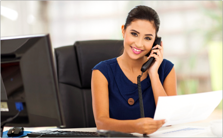 A Woman Using Aastra Office Phone A Woman Using Aastra Office Phone